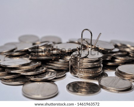 Concept of successful businessman on stack of coin