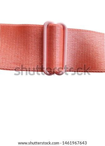 Plastic belt strapped to the fabric, cut into pinkish orange lines Put on the White Blackground