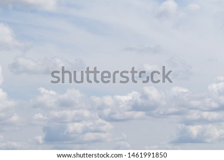 Blue sky with white fluffy clouds, sky background.