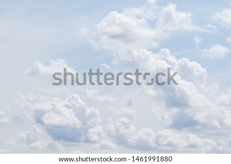 Blue sky with white fluffy clouds, sky background.
