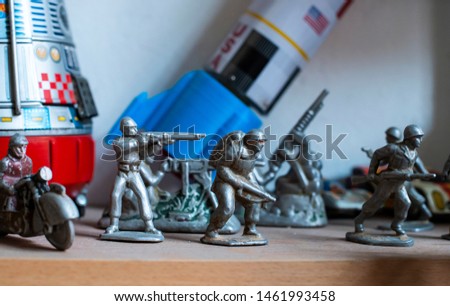 Old vintage lead soldiers toys on shelf. Collection of vintage toys in a shop. Bright colours. Royalty-Free Stock Photo #1461993458