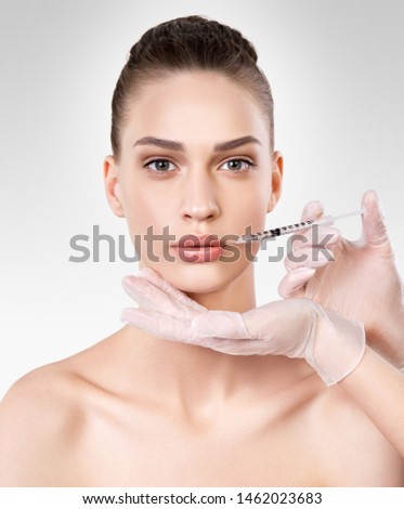 Isolated closeup portrait of beautiful young woman. Beauty procedure.  Beauty treatment Royalty-Free Stock Photo #1462023683