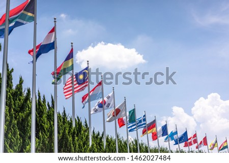 lot of flags with blue sky
