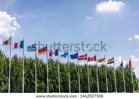 lot of flags with blue sky