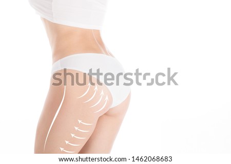 Woman attractive fit body and butt in base underwear. Lifting marking with arrows in female bum and hips, isolated on white. Plastic surgery, dieting, wellness, health, medicine, liposuction, lifting