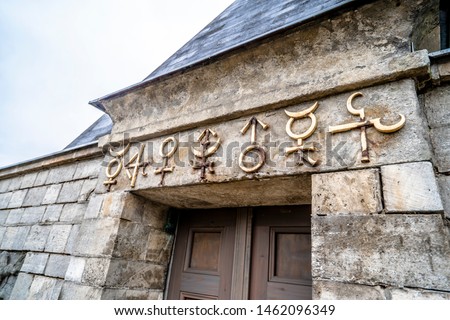 Decorative alchemical / astronomical symbols above the door of the cold storage room erected in 1791-1792, near the Marmorpalais (or Marble Palace), Potsdam, Germany.