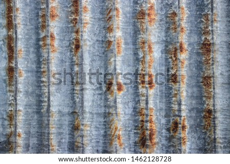 Rusty corrugated metal shutter worn grunge vintage background texture