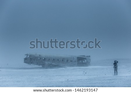 Island Solheimasandur plane wreck US Navy with photographer in snowstorm