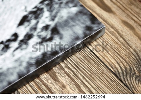 Photo canvas print. Sample of stretched photography with gallery wrapping on a wooden frame (stretcher bar). Lateral side view, closeup. Selective focus