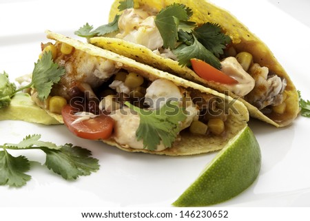 Fish Tacos using corn tortillas.