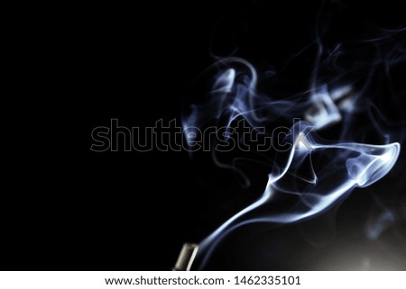 Incense smoke abstract on black background