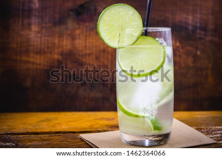 Lemon Fruit Lime Caipirinha of Brazil on grey vintage, Brazilian traditional drink, isolated with space for text.