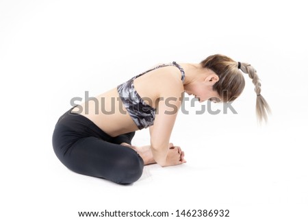 Sporty Asian young woman doing yoga practice isolated on white background.