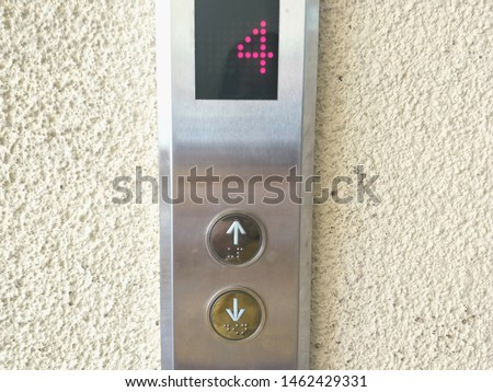 Up Arrow metal button's elevator.first floor display on panel.Elevator Conveying Transportation Concept of Elevator Arrow.
