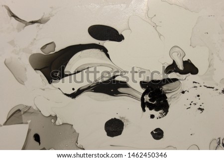 This is a photograph of a Black, Gray and White abstract background created using nail polish