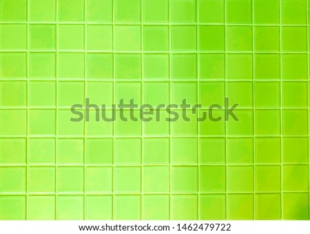 real photo of colorful bright green tiles  square mosaictiles wall of the bathroom