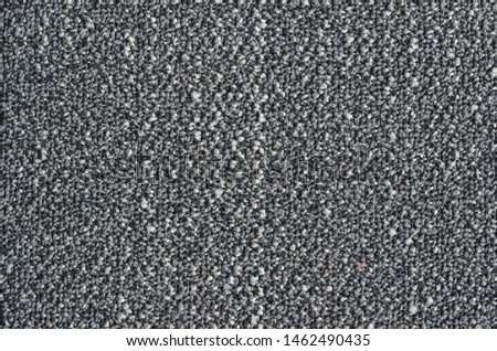 Seamless close up of monochrome grey carpet texture background