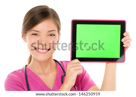 Medical nurse doctor showing tablet pc computer green screen with copy space for your text or design. Mixed race Asian Chinese / Caucasian female medical professional smiling happy on white background