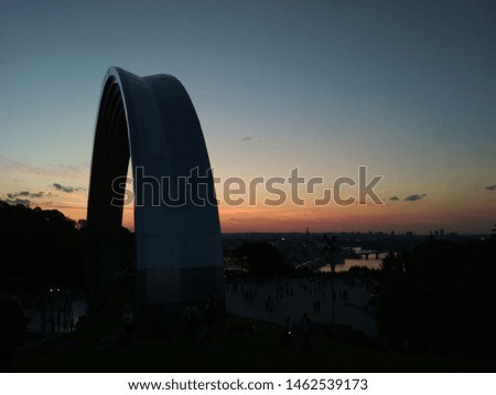 A silhouette of monument and city on twilight sky