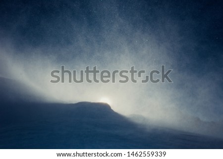Snowstorm in the mountains at winter time in Caucasus region, Elbrus mountain, Russia.  Royalty-Free Stock Photo #1462559339