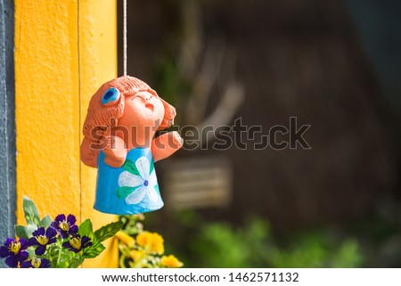 Baby dolls made from clay in garden.Thailand
