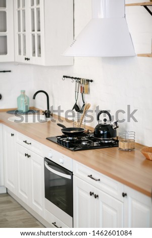 Luxurious white kitchen and living room in a big house Royalty-Free Stock Photo #1462601084