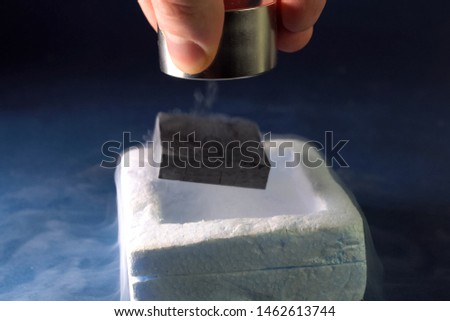 Superconductivity of magnets in liquid a nitrogen. Royalty-Free Stock Photo #1462613744