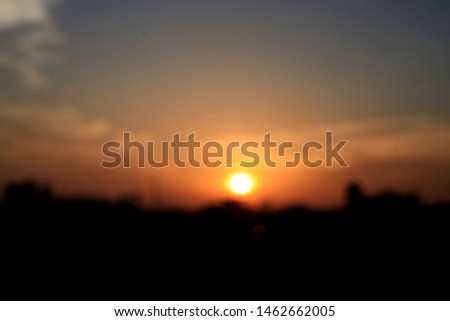 Blurred picture of sunset in the city for background and backdrop.