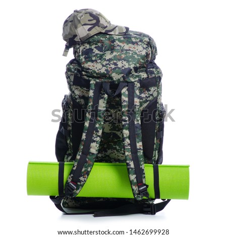 Military backpack with accessories cap hat hiking on white background isolation