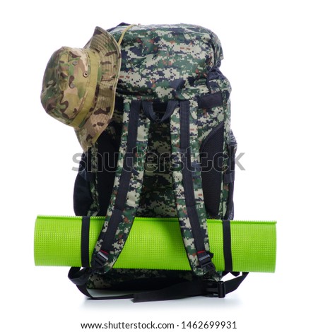 Military backpack with accessories cap hat hiking on white background isolation
