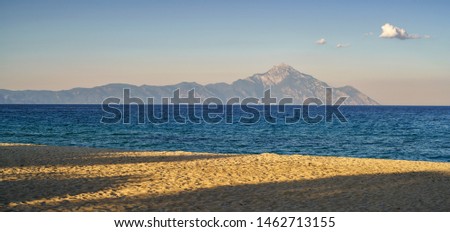 Holy mount Athos from Sarti, Sithonia, Halkidiki, Greece, late afternoon, shadows on the sandy beach