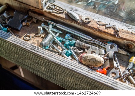 Wooden tool box of screws, anchors, nails, bolts. tool set of dowels, tool kit