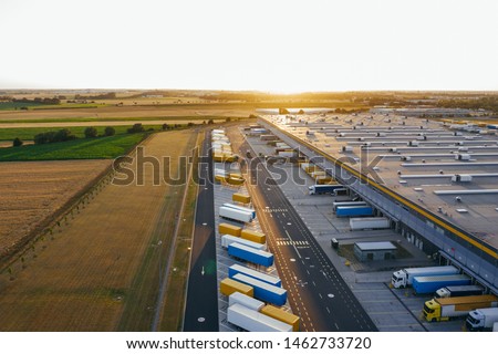 Aerial view of the distribution center, drone photography of the industrial logistic zone. Royalty-Free Stock Photo #1462733720