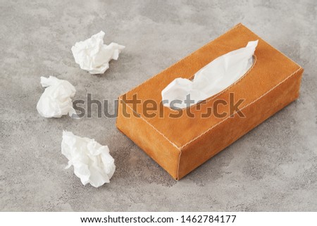 Tissue box on gray textured background. Healthcare and hygiene.