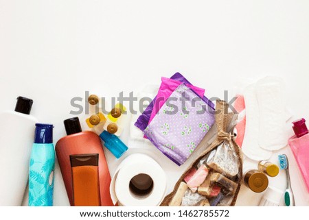 Toothbrush, wooden comb, white shampoo bottle and bath sponge on a white background. Flat lay. top view beauty items. Bathroom set