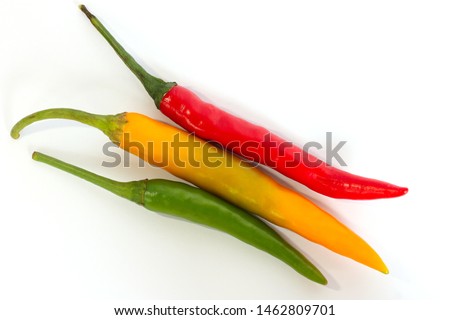 Chili peppers isolated.Red, green and yellow chili peppers isolated on the white background.Top view.