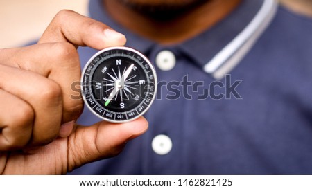 compass in hand and travel background, Guide texture.