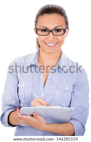 Closeup portrait of happy, smiling, young, beautiful woman/student or businessperson with eye glasses writing notes, isolated on white background