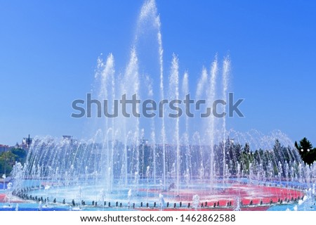 big Beautiful city fountain on a hot summer day