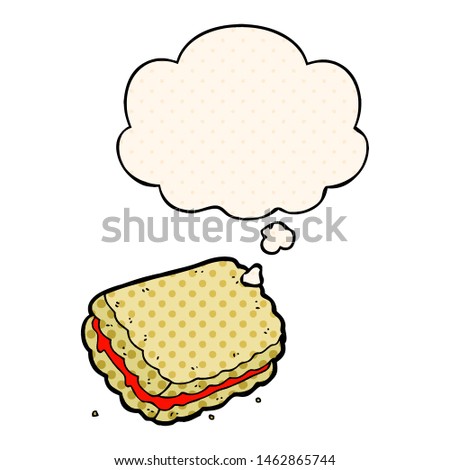 cartoon biscuit with thought bubble in comic book style