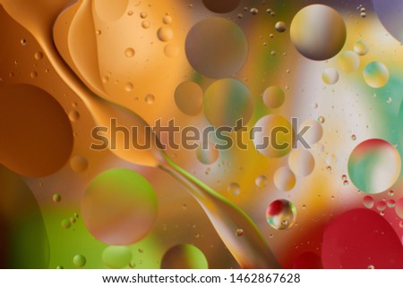 abstraction background with blurred colored stains of oil on water