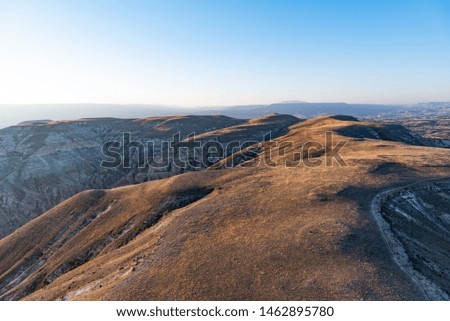 Aerial shot of hills during sunrise. Cappdocia valleys, Turkey.