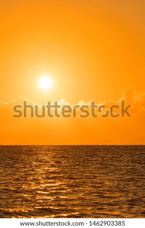 Colorful dawn over the sea, Sunset. Beautiful magic sunset over the sea. Beautiful sunset over the ocean. Sunset over water surface. vertical photo