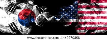 South Korea vs United States of America, American smoky mystic flags placed side by side. Thick colored silky abstract smoke flags of South Korean and United States of America, American Royalty-Free Stock Photo #1462970858