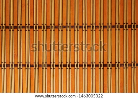 Brown rug background woven of straw, top view