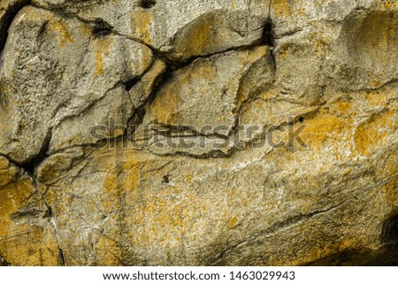 wall of rock, orange tint, cracks on the wall