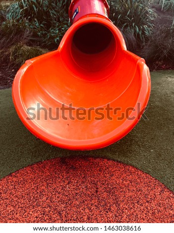 Red slide in kids play ground.