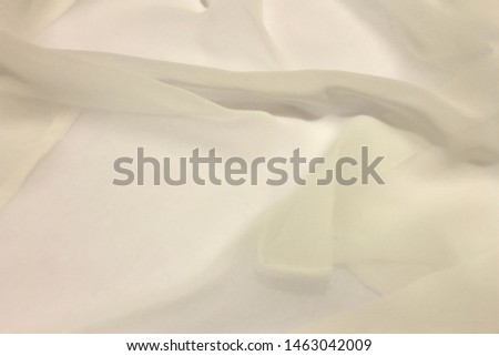 This is a photograph of White sheer fabric