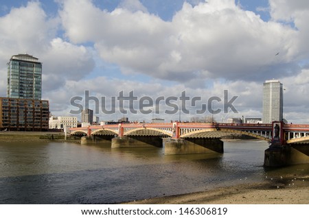 The Victorian cast iron Vauxhall Bridge crossing the River Thames in Central London.