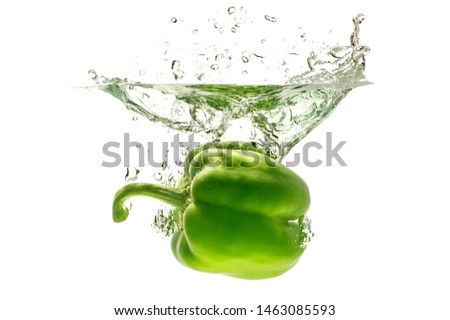 
Sweet pepper in water, isolated on white